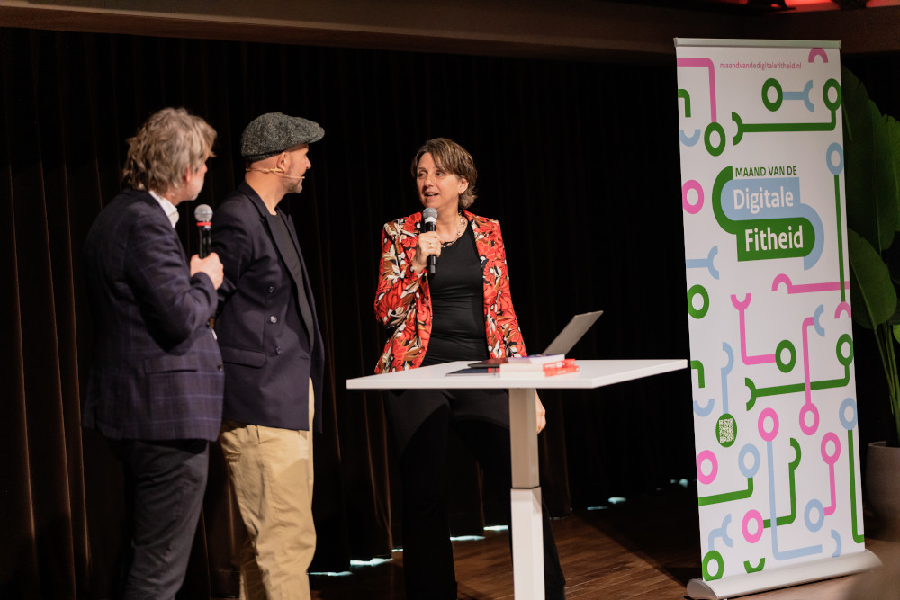 Martijn Aslander, Lars Sorensen en Marie Louise Borsje in gesprek op het podium.